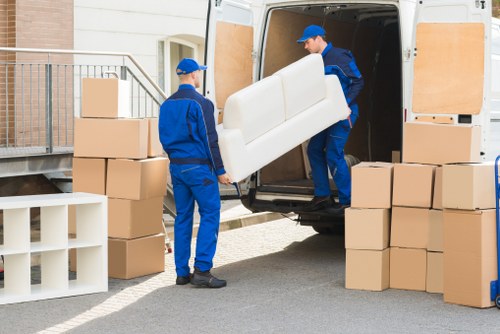 Loading boxes and furniture into a van in Castelnau