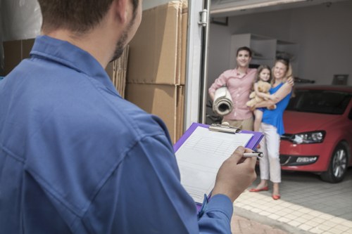 Driver and helper preparing for a move near Castelnau homes